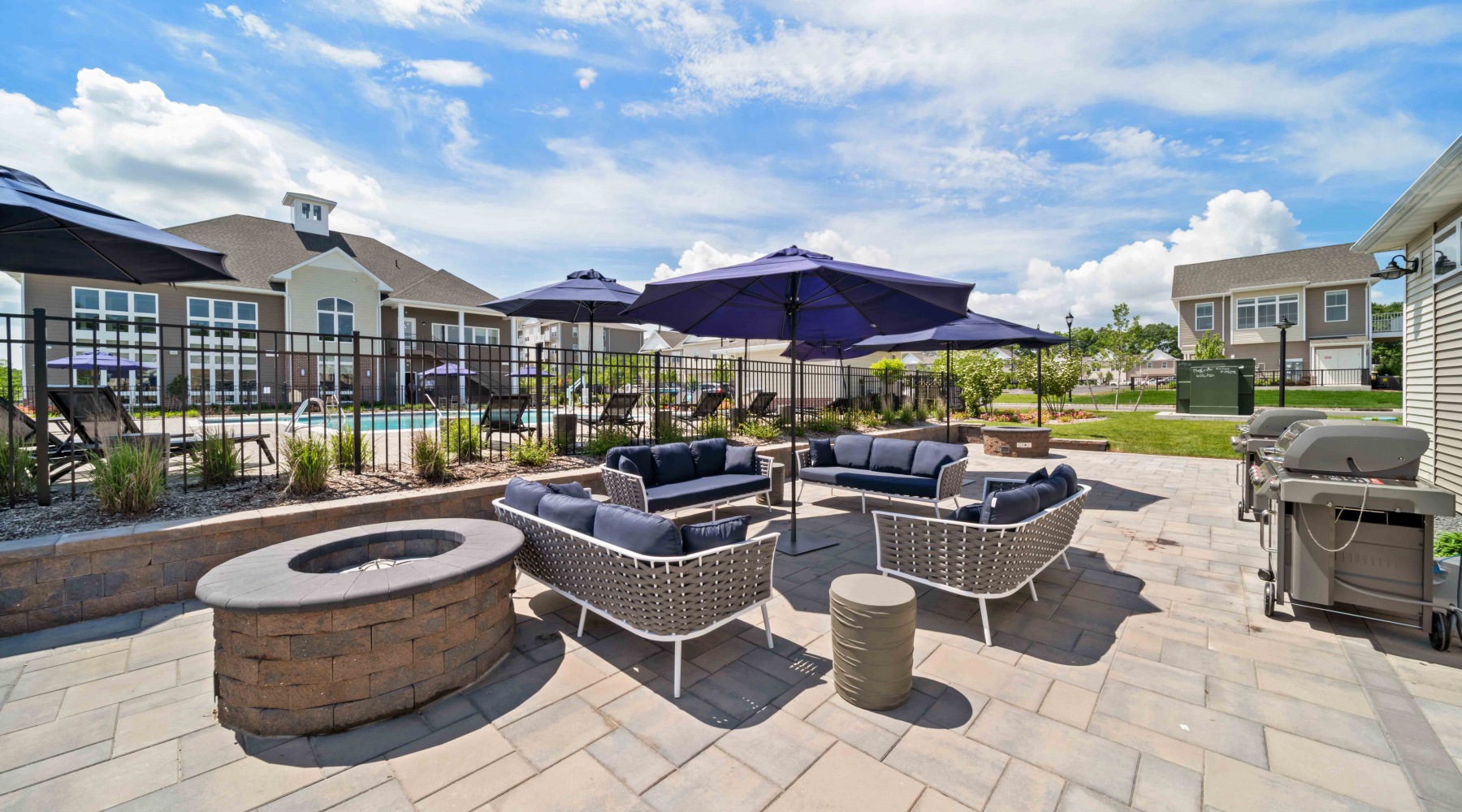 outdoor courtyard with fire pit and seating area